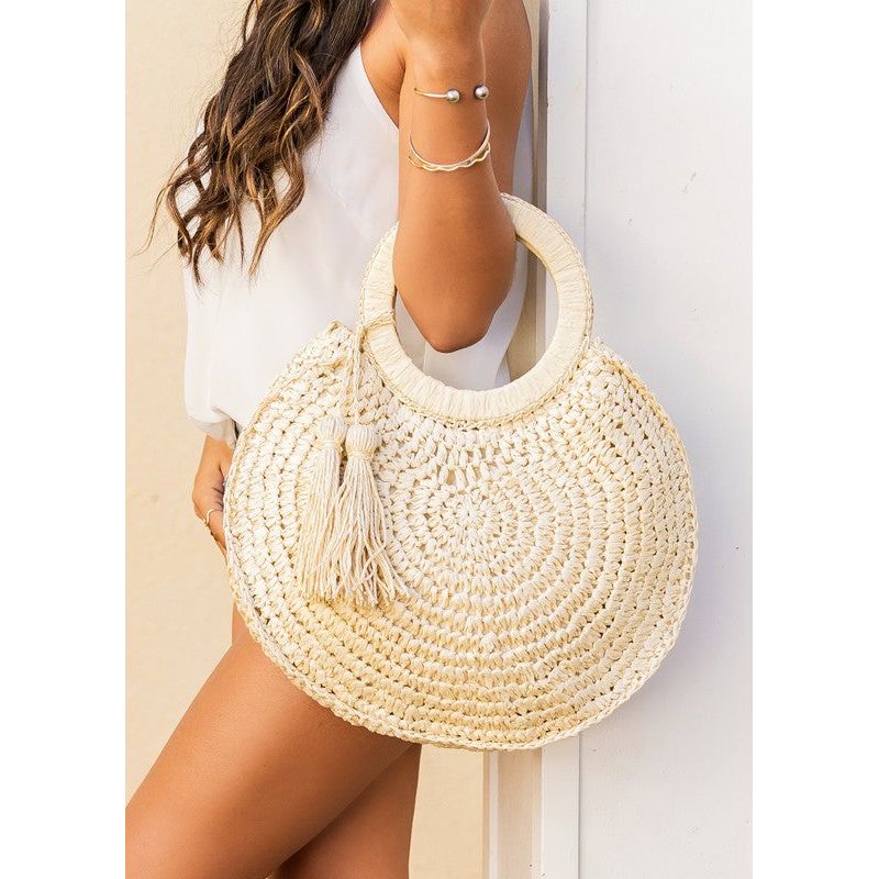 The Tassel O-Ring Straw Tote Bag In Khaki or Off White