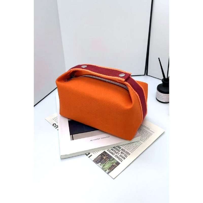 The Waterproof Canvas Travel Cosmetic Bag In Pink, Orange, Black Or Cream